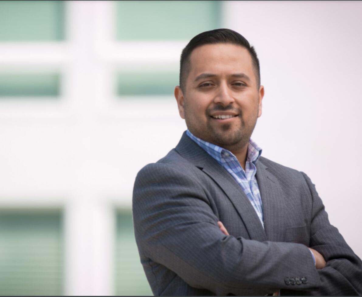 Spherion Direct finds permanent hires for influential roles at your business A Hispanic man in a suit with his arms crossed