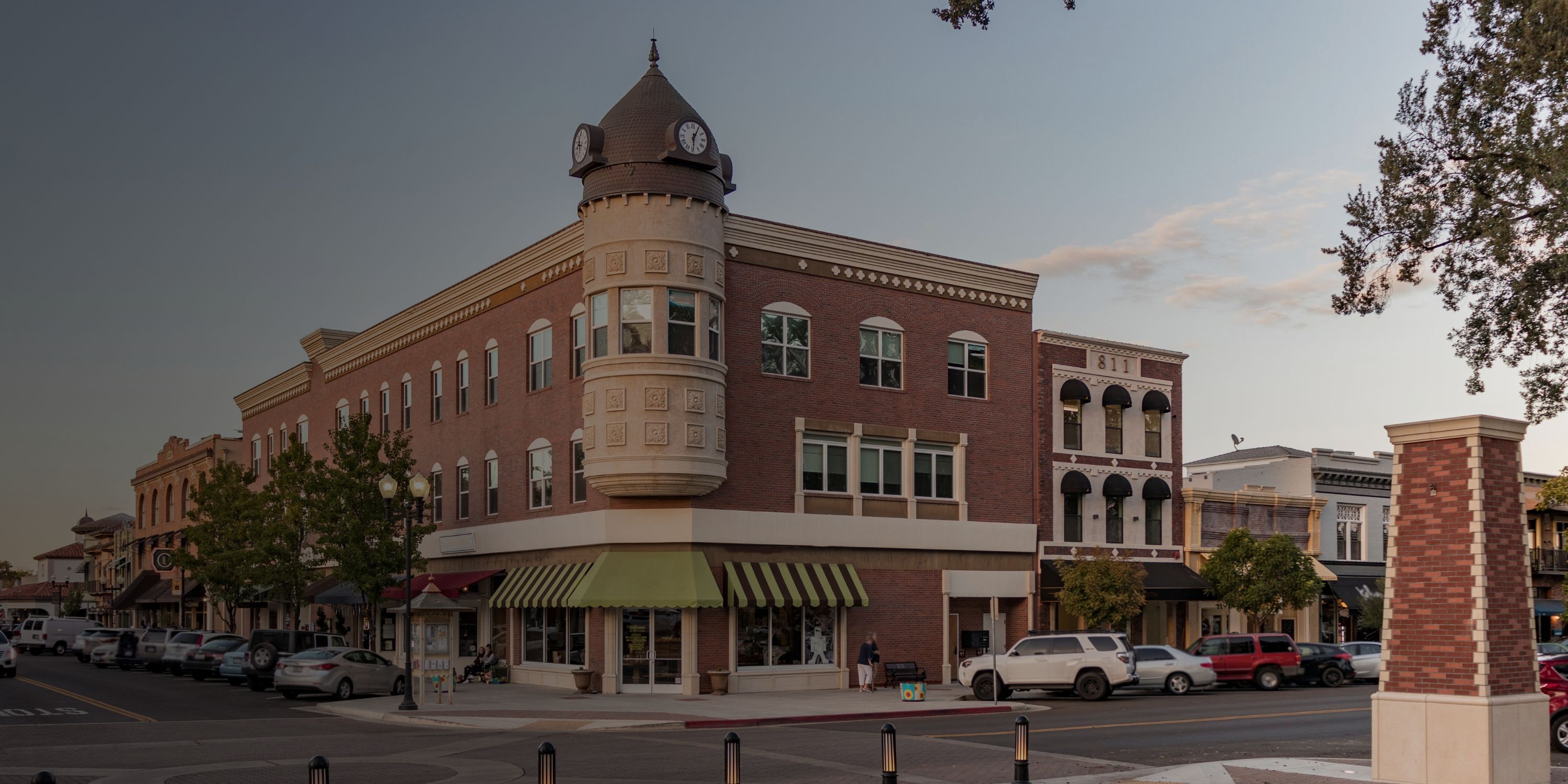 Photo of a tan and brick office building in downtown Paso Roles, California