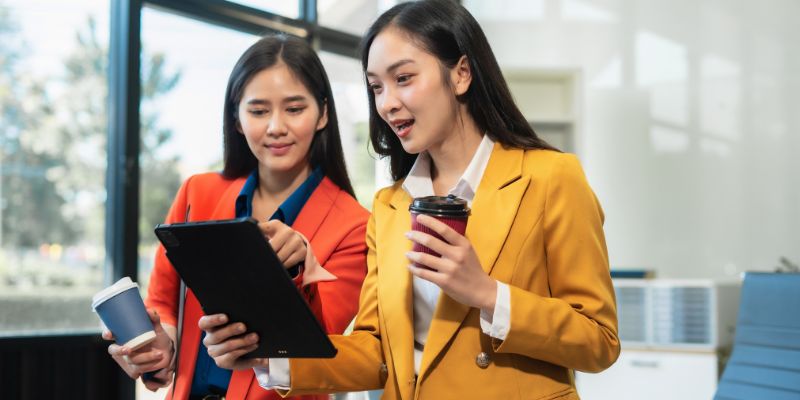 Two businesswomen looking at an iPad